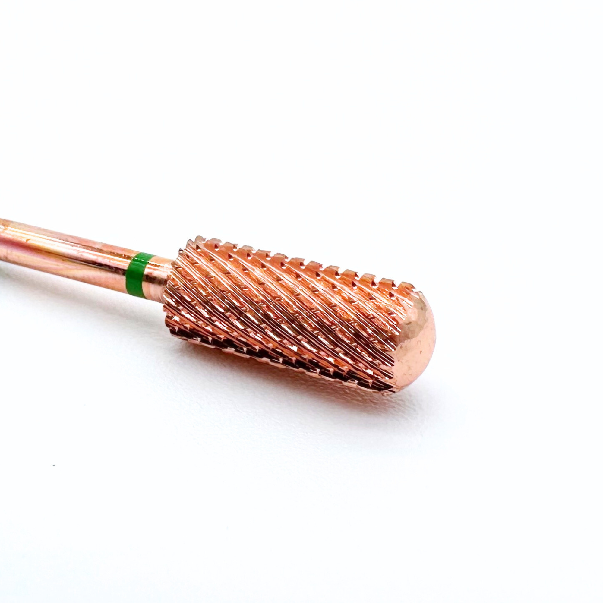 Rose gold barrel with black bristles on a white background